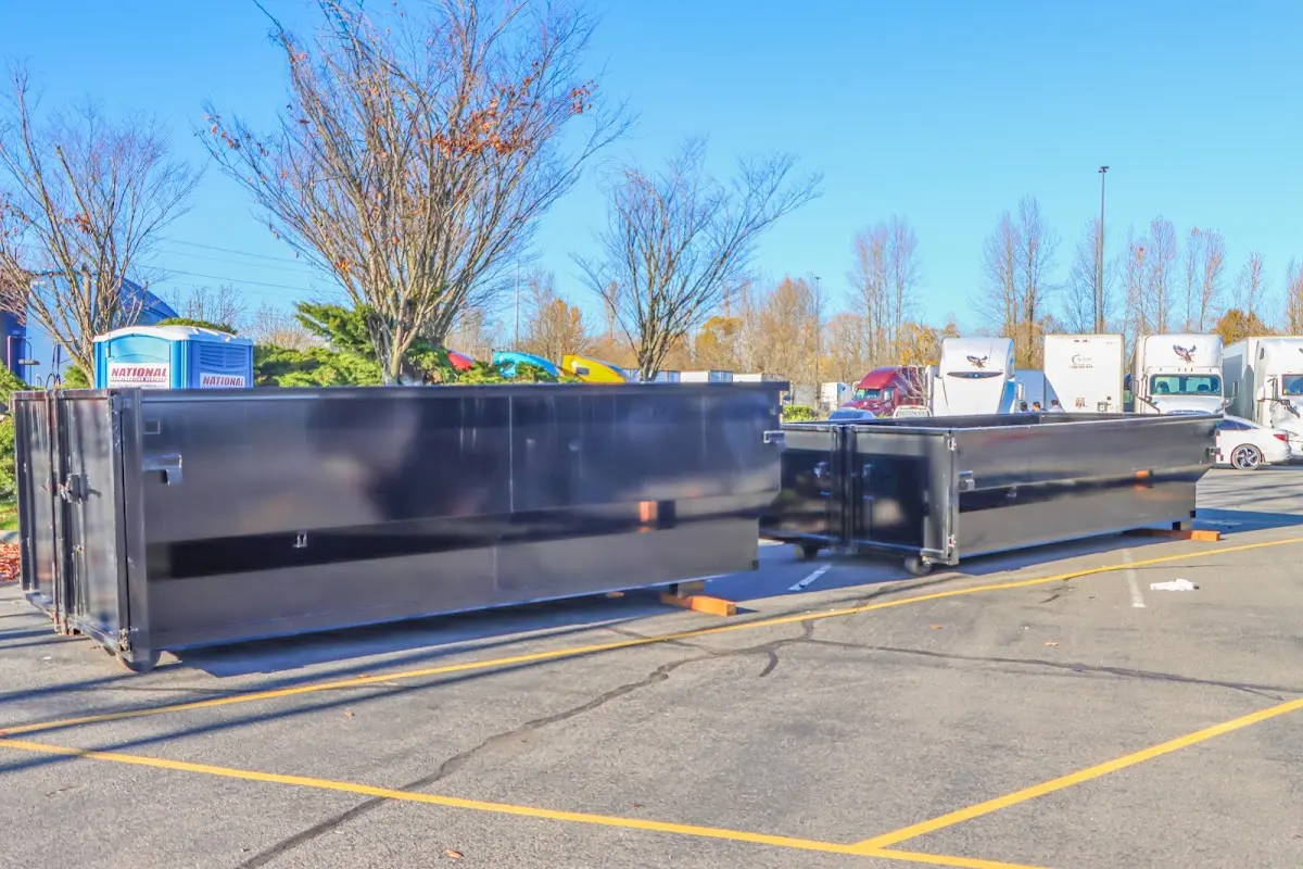 Professional dumpster rental service with roll-off container on residential driveway in Olathe